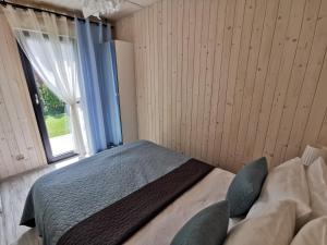 Postel nebo postele na pokoji v ubytování Domek Morski