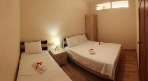 Postel nebo postele na pokoji v ubytování Hotel Tao