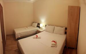 Postel nebo postele na pokoji v ubytování Hotel Tao
