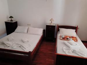 Postel nebo postele na pokoji v ubytování Ξενοδοχείο 'ΠΑΛΛΑΔΙΟΝ' Hotel 'PALLADION'