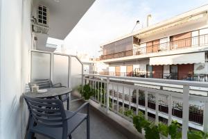 a patio with a table and chairs on a balcony at Atlantis ''Pleasure by the Sea'' in Perea