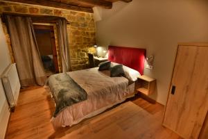 Un pat sau paturi într-o cameră la El Pontón de Lanchares