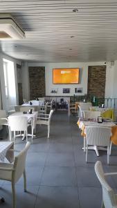 Un restaurante o sitio para comer en B&B Il Porto Vecchio
