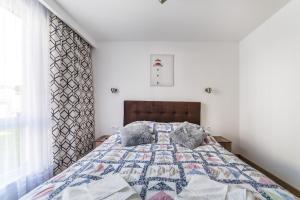 Posteľ alebo postele v izbe v ubytovaní Apartament Relax