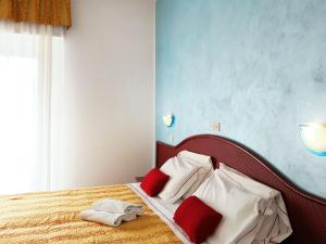 Postel nebo postele na pokoji v ubytování Hotel Vittoria - Nuova Gestione