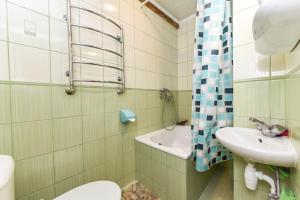 a bathroom with a sink and a toilet and a shower at Ramus poilsis Karklėje in Karklė +40 photos