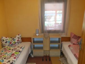 Krevet ili kreveti u jedinici u okviru objekta Rába Part Apartman