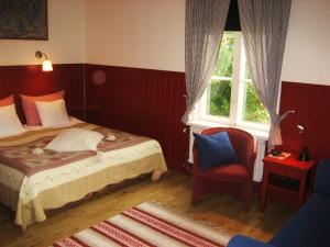 Postel nebo postele na pokoji v ubytování Lugnet Malung Hotell
