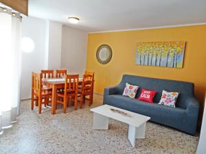 a living room with a couch and a table at ROMA 11 GANDÍA - Alquiler a familias in Gandía