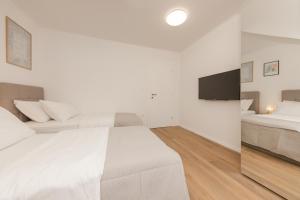 Postel nebo postele na pokoji v ubytování Enjoy Split, new apartment in the center with a private garden