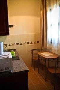 A kitchen or kitchenette at Spirit Apartman