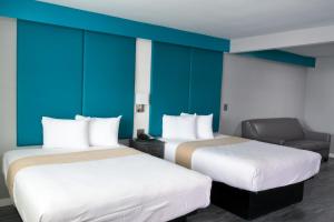 Postel nebo postele na pokoji v ubytování Tilbury Inn