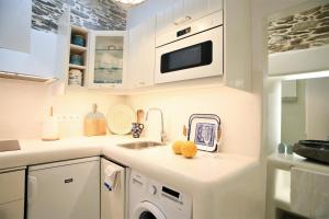 Kuchyňa alebo kuchynka v ubytovaní Lasia Boutique Apartment