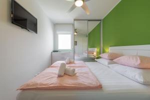 Posteľ alebo postele v izbe v ubytovaní Apartman "Bubi"