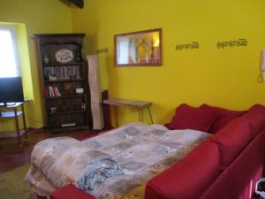 A bed or beds in a room at La casetta nel cortile