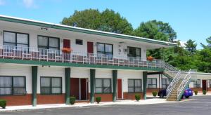 a building with a staircase on the side of it at Travelers Inn in Brunswick