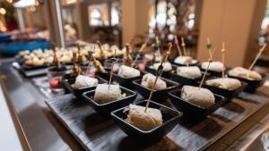 a buffet with a bunch of bowls of food at TUI Blue Isla Cristina Palace - Adults Recommended in Isla Cristina
