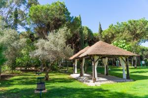a gazebo in a park with green grass at TUI Blue Isla Cristina Palace - Adults Recommended in Isla Cristina