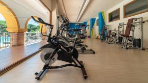a gym with several treadmills and exercise bikes at TUI Blue Isla Cristina Palace - Adults Recommended in Isla Cristina