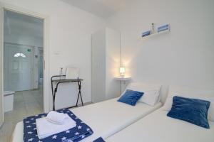 Postel nebo postele na pokoji v ubytování Apartman Luka