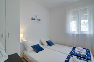 Postel nebo postele na pokoji v ubytování Apartman Luka
