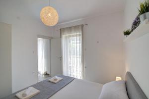 Postel nebo postele na pokoji v ubytování Apartman Luka