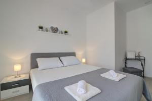 Postel nebo postele na pokoji v ubytování Apartman Luka
