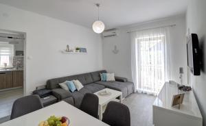 TV a/nebo společenská místnost v ubytování Apartman Luka