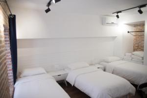 Letto o letti in una camera di Old Bazaar Rooms