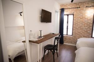 Letto o letti in una camera di Old Bazaar Rooms