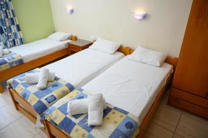 Postel nebo postele na pokoji v ubytování GLIKERIA ROOMS + 37 fotografií