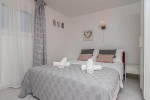 Posteľ alebo postele v izbe v ubytovaní Apartment Lisinski