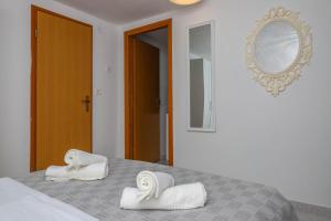 Posteľ alebo postele v izbe v ubytovaní Apartment Lisinski