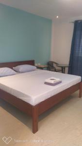 Postel nebo postele na pokoji v ubytování D & B BLUESTAR BEACH RESORT