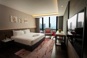 Postel nebo postele na pokoji v ubytování Jazz Hotel Penang