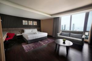 Postel nebo postele na pokoji v ubytování Jazz Hotel Penang