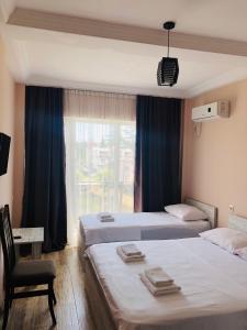 Voodi või voodid majutusasutuse Hotel Crown toas