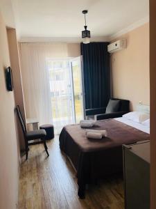 Voodi või voodid majutusasutuse Hotel Crown toas
