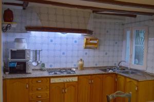 Kuchyň nebo kuchyňský kout v ubytování Casa Azafrán