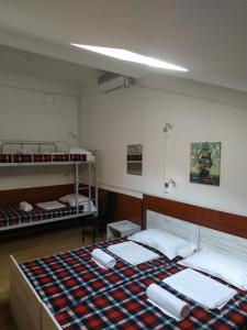 Voodi või voodid majutusasutuse Hostel Portal toas