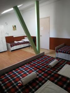 Voodi või voodid majutusasutuse Hostel Portal toas