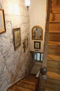 a staircase in a building with pictures on the wall at Studios Jacobus in Korčula