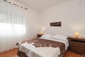 Postel nebo postele na pokoji v ubytování Yole apartman