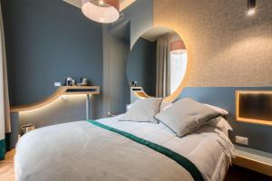 Postel nebo postele na pokoji v ubytování Le Texture Premium Rooms Duomo-Cordusio
