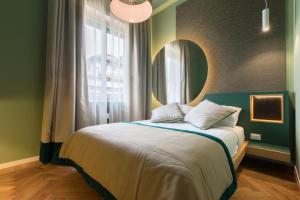 Postel nebo postele na pokoji v ubytování Le Texture Premium Rooms Duomo-Cordusio