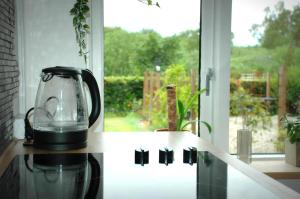 a blender sitting on a counter next to a window at Bakkely GuestHouse in Randers