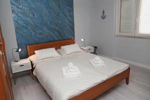 Postel nebo postele na pokoji v ubytování Apartment Eva
