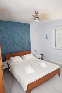 Postel nebo postele na pokoji v ubytování Apartment Eva