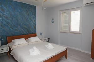 Postel nebo postele na pokoji v ubytování Apartment Eva