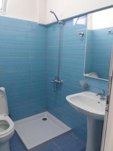 Koupelna v ubytování Qeparo Antonio Rooms